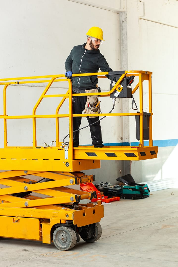 Worker builds a plasterboard wall.